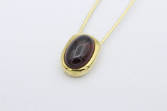Pomellato Brosche Sicherheitsnadel aus 750 / 18k Gold mit ein Granat in Cabochon