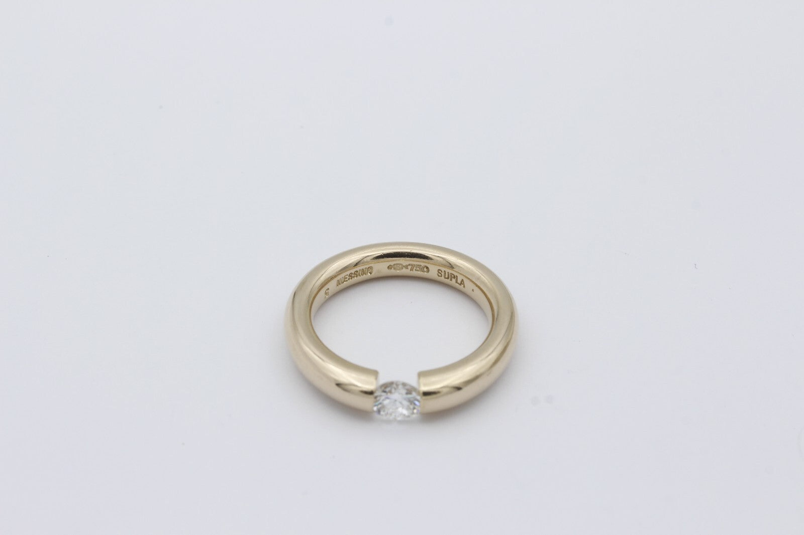 Niessing Spannring 750 / 18 Karat Gold Solitär Brillant ca. 0,45 ct.